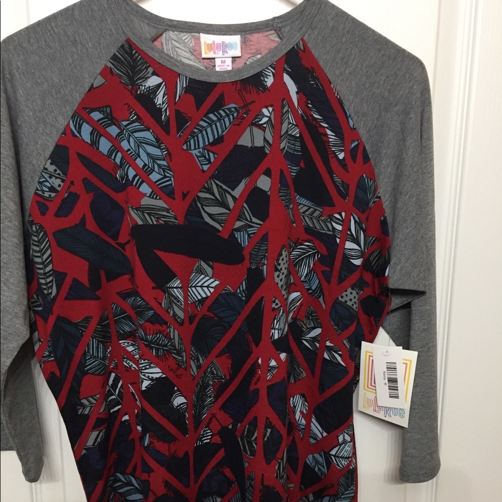 Lularoe Randy size Medium Feathers